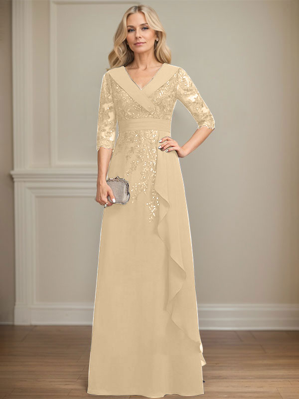 Vestido de novia de corte línea A, cuello en V, largo hasta el suelo, de encaje y gasa, con lentejuelas y volantes en cascada. 
