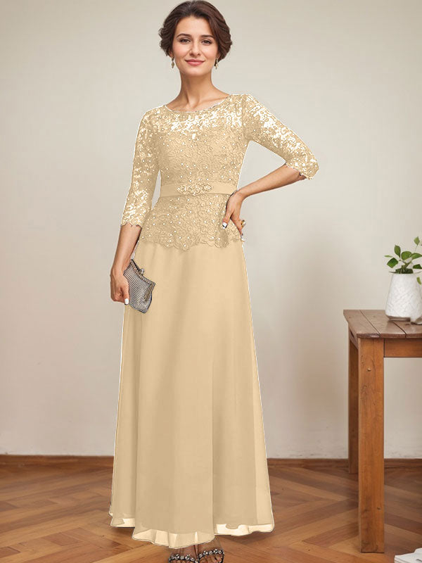 Vestido de novia corte A, escote redondo ilusión, largo hasta el tobillo, de gasa y encaje, con pedrería y detalles de diamantes de imitación. 