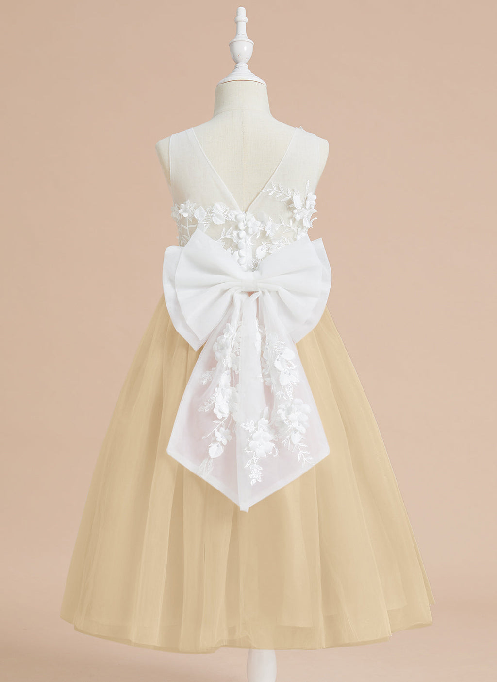 Vestido midi de encaje floral y lazo grande 