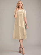 Vestido de corte A, escote redondo, largo hasta la rodilla, para la madre de la novia, con apliques y lentejuelas. 
