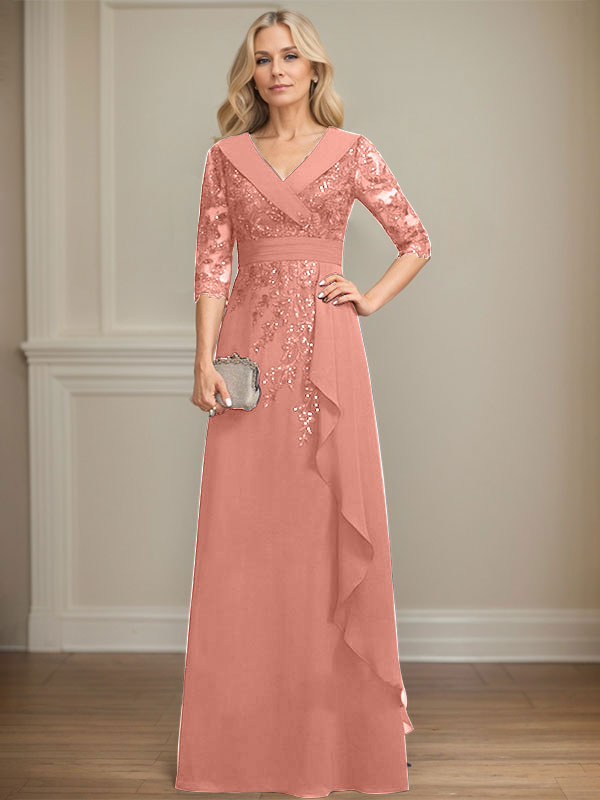Vestido de novia de corte línea A, cuello en V, largo hasta el suelo, de encaje y gasa, con lentejuelas y volantes en cascada. 