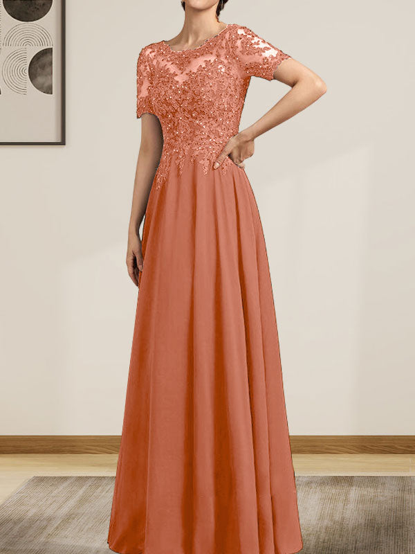 Vestido de corte A, escote ilusión, largo hasta el suelo, de gasa y encaje, con lentejuelas y pedrería, para la madre de la novia.