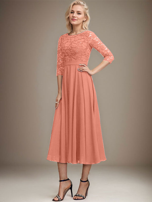 Vestido de novia de corte línea A, escote redondo, largo hasta la rodilla, de encaje y gasa con lentejuelas.