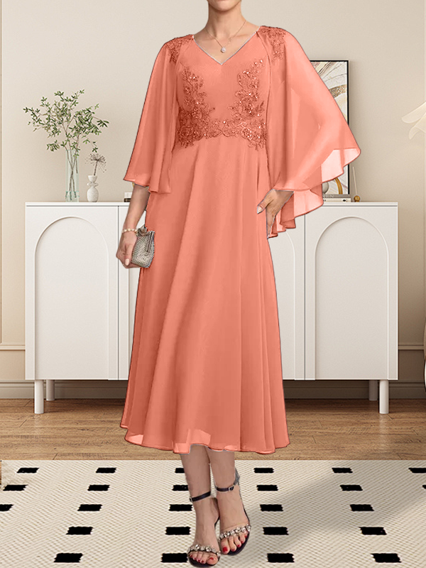 Vestido de corte A, escote en V, largo hasta la rodilla, de gasa, encaje, con lentejuelas y pedrería para la madre de la novia.