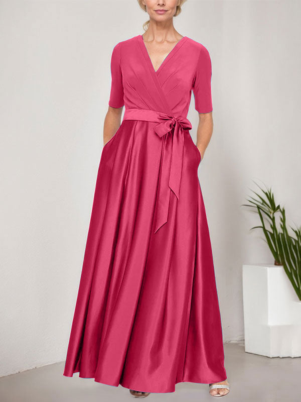 Vestido de baile con escote cruzado, falda amplia de satén y corpiño de jersey. 
