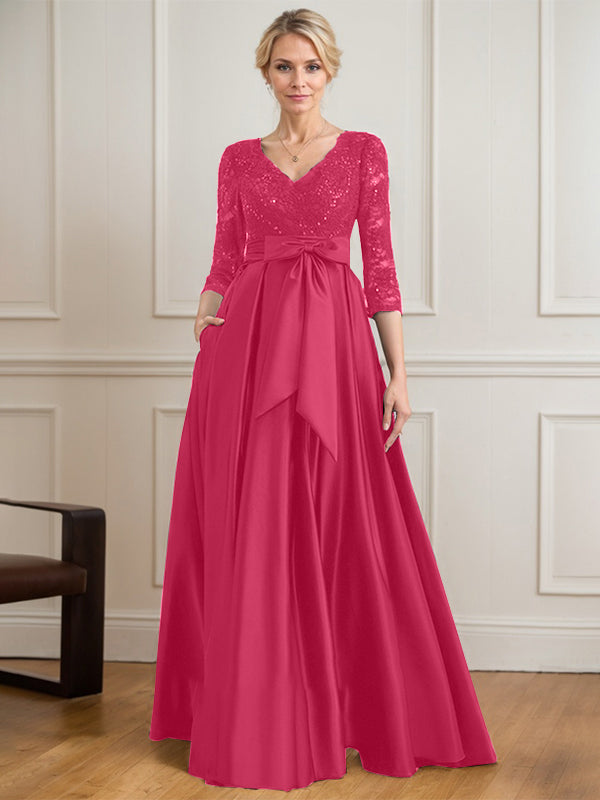 Vestido de novia de satén con encaje, corte en A, escote en V y largo hasta el suelo, con lazo de lentejuelas. 