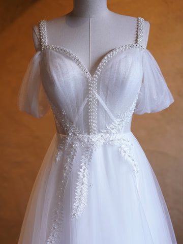 Vestidos de fiesta largos hasta el suelo con escote en V y adornos de perlas