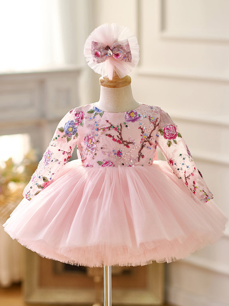 Vestido de bebé niña color lila con lentejuelas, mangas largas con volantes y largo hasta la rodilla 