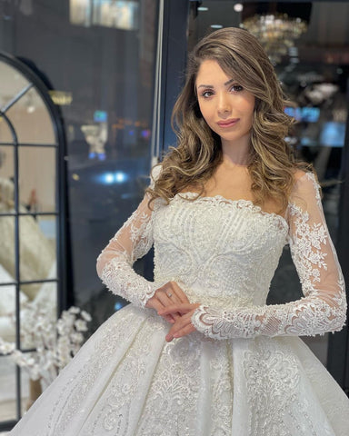 Vestido de novia de encaje de corte A, largo hasta el suelo, de lujo, con mangas largas y volantes.