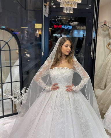 Vestido de novia de encaje de corte A, largo hasta el suelo, de lujo, con mangas largas y volantes.