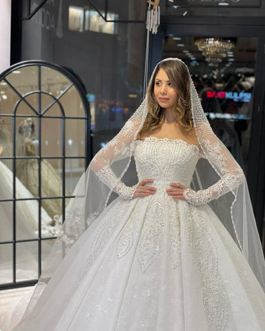 Vestido de novia de encaje de corte A, largo hasta el suelo, de lujo, con mangas largas y volantes.