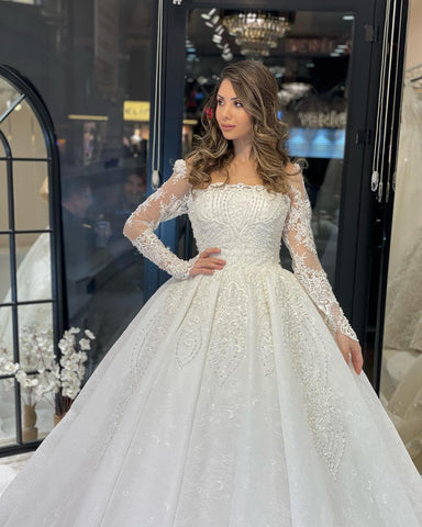 Vestido de novia de encaje de corte A, largo hasta el suelo, de lujo, con mangas largas y volantes.