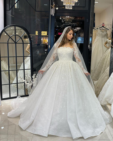 Vestido de novia de encaje de corte A, largo hasta el suelo, de lujo, con mangas largas y volantes.