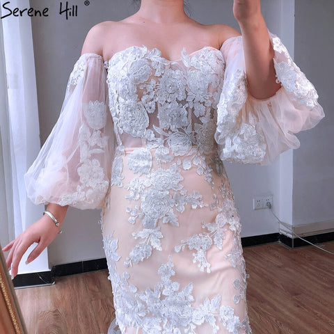 Vestidos de novia estilo sirena, color blanco nude, sexys, estilo Dubai, colección 2025, con mangas abullonadas, flores y pedrería. Modelo LA70417. Hechos a medida. 