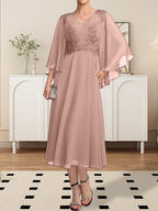 Vestido de corte A, escote en V, largo hasta la rodilla, de gasa, encaje, con lentejuelas y pedrería para la madre de la novia.