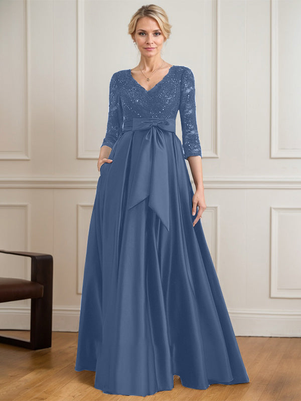 Vestido de novia de satén con encaje, corte en A, escote en V y largo hasta el suelo, con lazo de lentejuelas. 