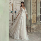 Vestido de novia elegante corte A, manga abullonada, espalda descubierta, apliques de cuentas, escote en V.