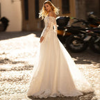Vestidos de novia elegantes de manga larga, escote barco con hombros descubiertos, apliques de encaje y cola de barrido. Vestido de novia corte A.