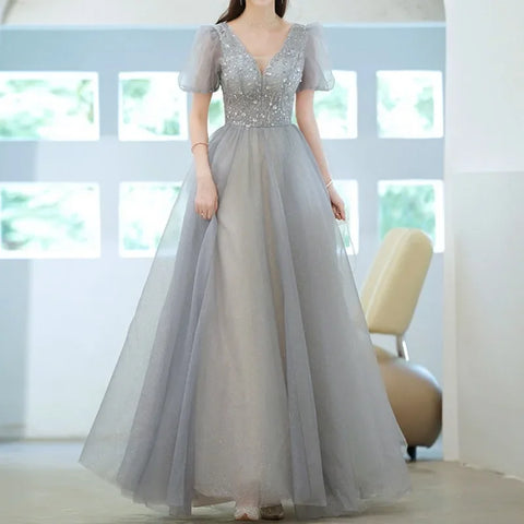 Elegante vestido de princesa para baile de graduación, de noche, con escote en V, mangas abullonadas y detalle de vendaje. Vestido largo floral con brillo. 