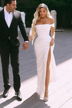 Vestidos de novia elegantes, con abertura frontal, hombros descubiertos, mangas cortas, largo hasta el suelo y volantes.