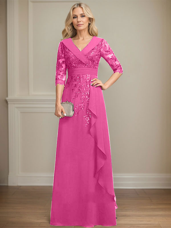 Vestido de novia de corte línea A, cuello en V, largo hasta el suelo, de encaje y gasa, con lentejuelas y volantes en cascada. 