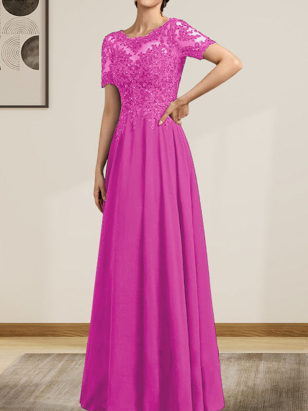 Vestido de corte A, escote ilusión, largo hasta el suelo, de gasa y encaje, con lentejuelas y pedrería, para la madre de la novia.