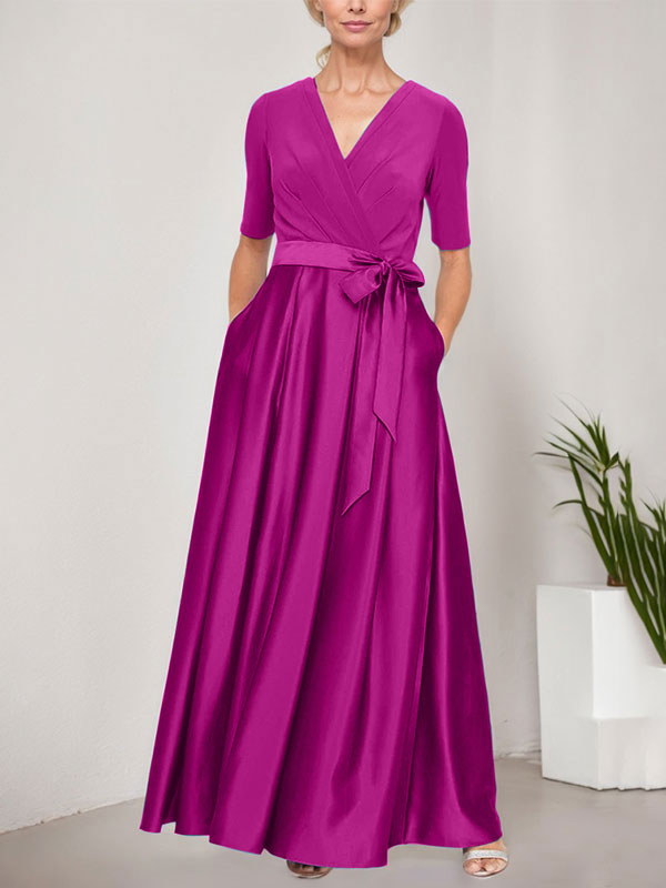 Vestido de baile con escote cruzado, falda amplia de satén y corpiño de jersey. 