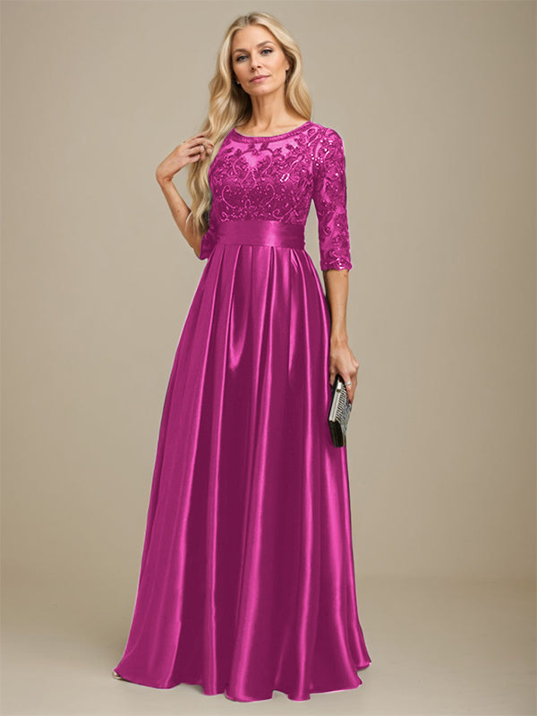 Robe de mariée longue en satin stretch dentelle et dentelle, coupe trapèze, décolleté illusion, ornée d'un nœud à sequins 