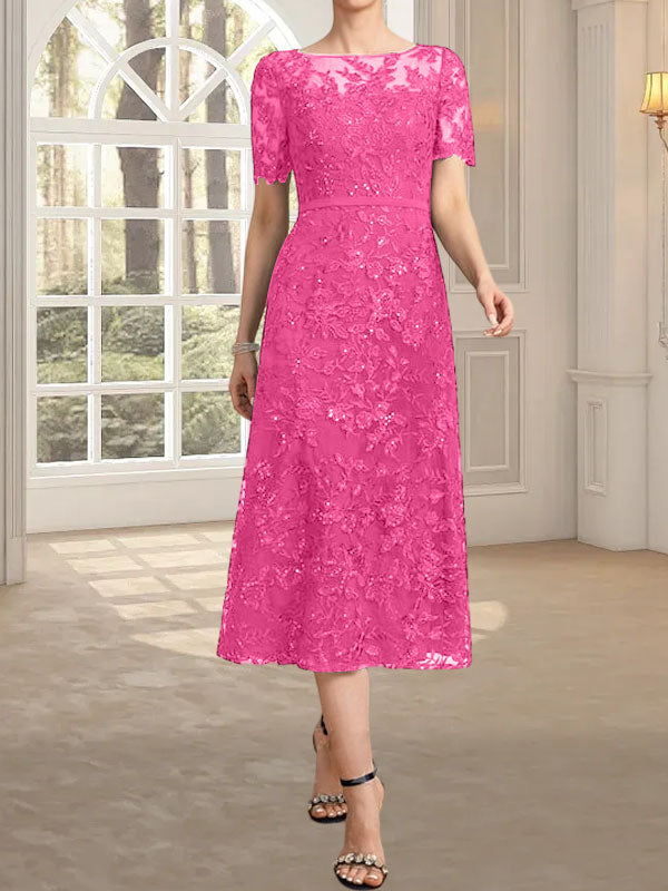 Vestido de novia de encaje con lentejuelas, corte en A, escote redondo ilusión y largo hasta la rodilla.