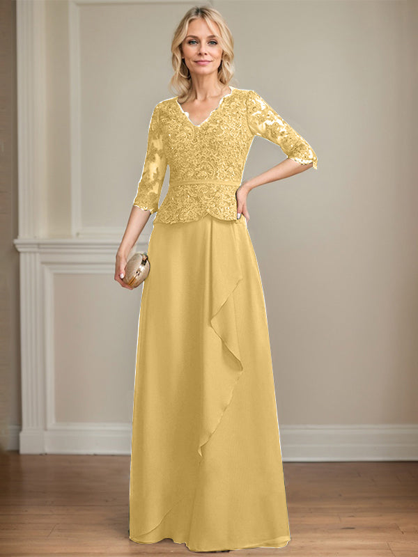 Robe de mère de la mariée en mousseline de dentelle, coupe trapèze, col en V, longueur au sol, ornée de volants et de sequins. 