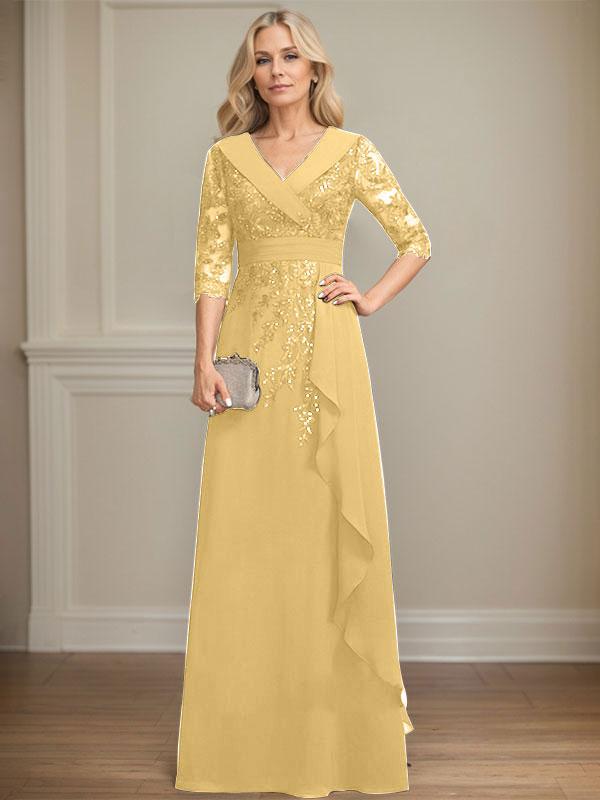 Vestido de novia de corte línea A, cuello en V, largo hasta el suelo, de encaje y gasa, con lentejuelas y volantes en cascada. 