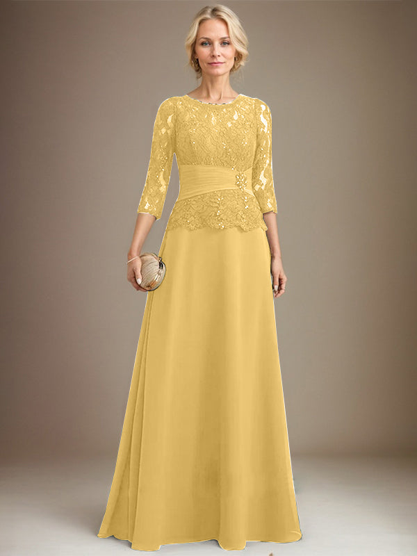 Vestido de corte A, escote ilusión, largo hasta el suelo, de gasa y encaje, para la madre de la novia, con lentejuelas plisadas y pedrería. 