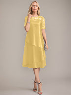 Vestido de corte A, escote redondo, largo hasta la rodilla, para la madre de la novia, con apliques y lentejuelas. 