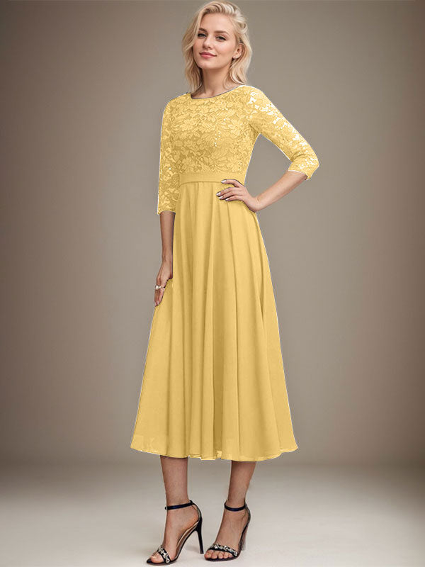 Vestido de novia de corte línea A, escote redondo, largo hasta la rodilla, de encaje y gasa con lentejuelas.