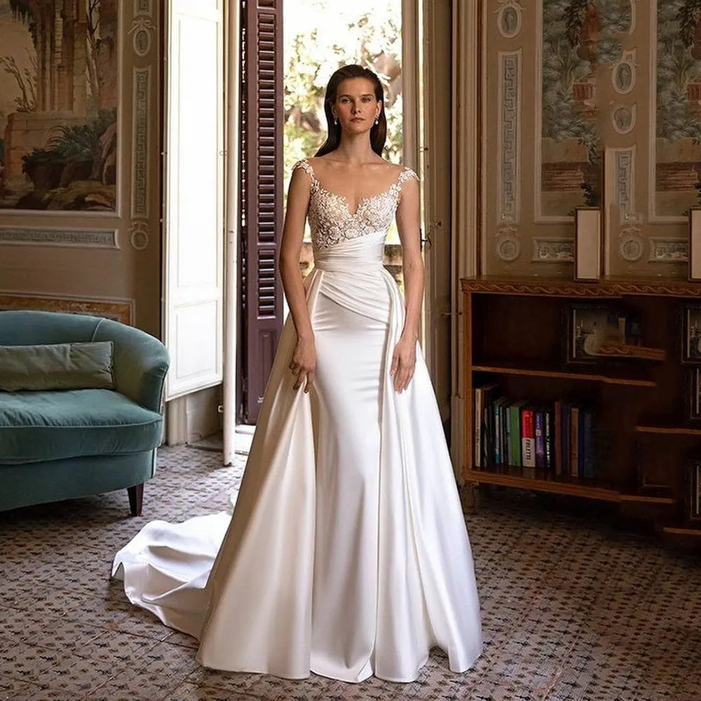 Robe de mariée sirène champêtre somptueuse, surjupe à manches courtes, élégantes applications de dentelle, satin et tourbe.