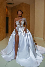 Precioso vestido de novia largo de corte A, de satén, con un solo hombro, apliques de encaje y abertura, adornado con cuentas.