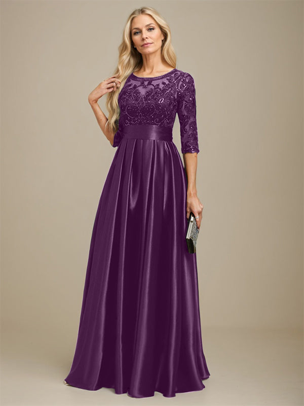 Vestido de madrina de la novia, corte en A, escote ilusión, largo hasta el suelo, satén elástico con encaje y lazo de lentejuelas. 