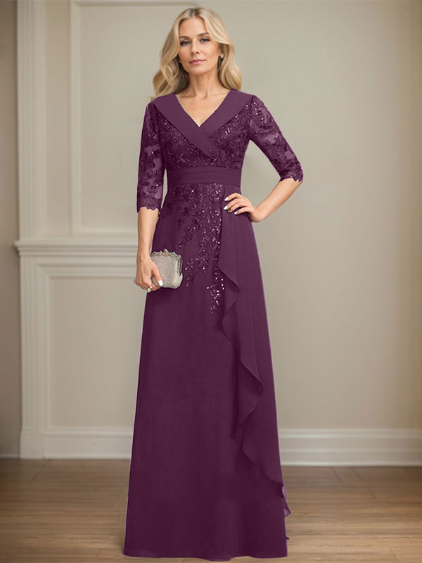 Vestido de novia de corte línea A, cuello en V, largo hasta el suelo, de encaje y gasa, con lentejuelas y volantes en cascada. 