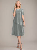 Vestido de corte A, escote redondo, largo hasta la rodilla, para la madre de la novia, con apliques y lentejuelas. 