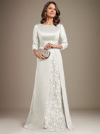 Robe de mère de la mariée en satin de dentelle, coupe trapèze, longue jusqu'au sol, ornée d'appliqués, avec décolleté plongeant et bretelles.