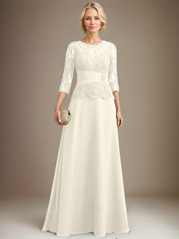 Vestido de corte A, escote ilusión, largo hasta el suelo, de gasa y encaje, para la madre de la novia, con lentejuelas plisadas y pedrería. 