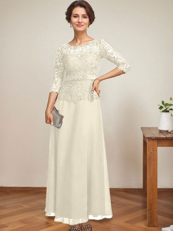 Vestido de novia corte A, escote redondo ilusión, largo hasta el tobillo, de gasa y encaje, con pedrería y detalles de diamantes de imitación. 