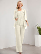 Vestido de novia de gasa con encaje y lentejuelas, estilo mono/pantalón, largo hasta el suelo, con escote redondo.