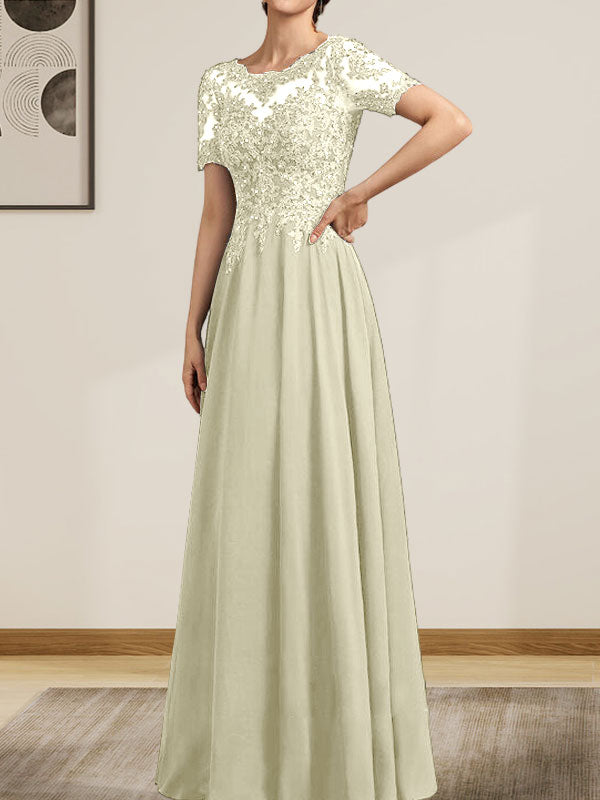 Vestido de corte A, escote ilusión, largo hasta el suelo, de gasa y encaje, con lentejuelas y pedrería, para la madre de la novia.