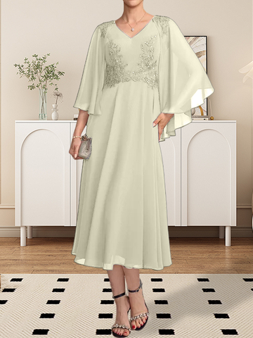 Vestido de corte A, escote en V, largo hasta la rodilla, de gasa, encaje, con lentejuelas y pedrería para la madre de la novia.