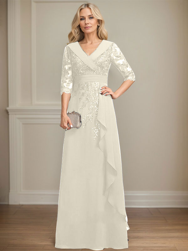 Vestido de novia de corte línea A, cuello en V, largo hasta el suelo, de encaje y gasa, con lentejuelas y volantes en cascada. 