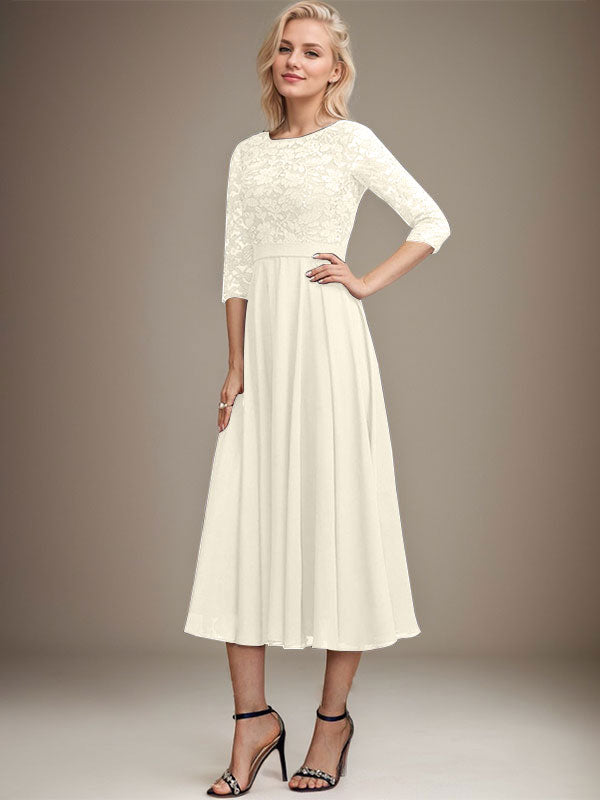 Vestido de novia de corte línea A, escote redondo, largo hasta la rodilla, de encaje y gasa con lentejuelas.
