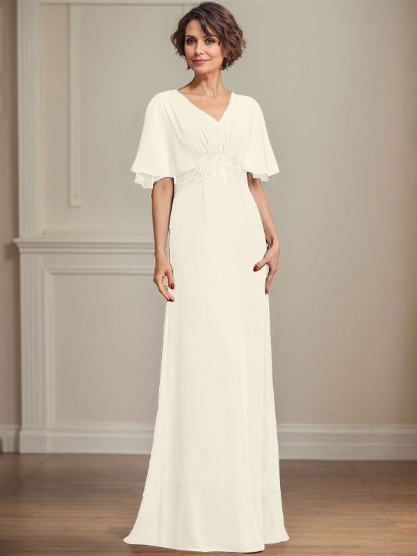Robe de mariée longue en mousseline de soie, coupe trapèze, col en V, ornée d'appliques de sequins plissés et de dentelle.