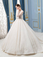 Robe de mariée de style bal, luxueuse, perlée, longueur au sol, manches longues 