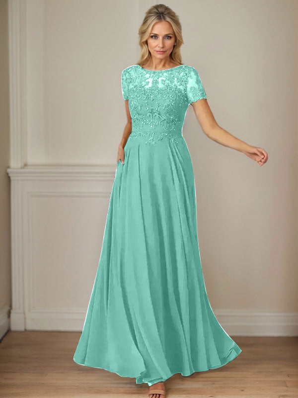 Robe en mousseline de soie bleu marine foncé, coupe trapèze, col bateau et sequins 